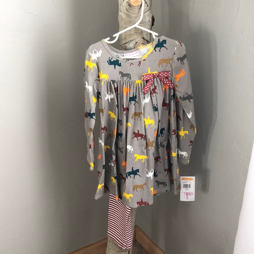 Girls horse tunic with striped leggings.